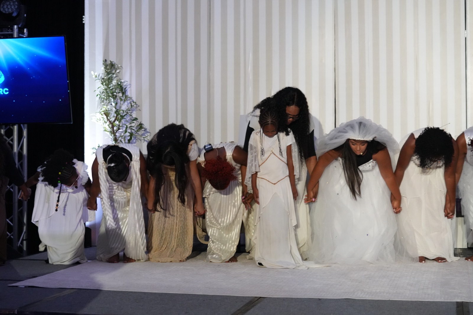 The company bows together at the close of the Full Flame Production