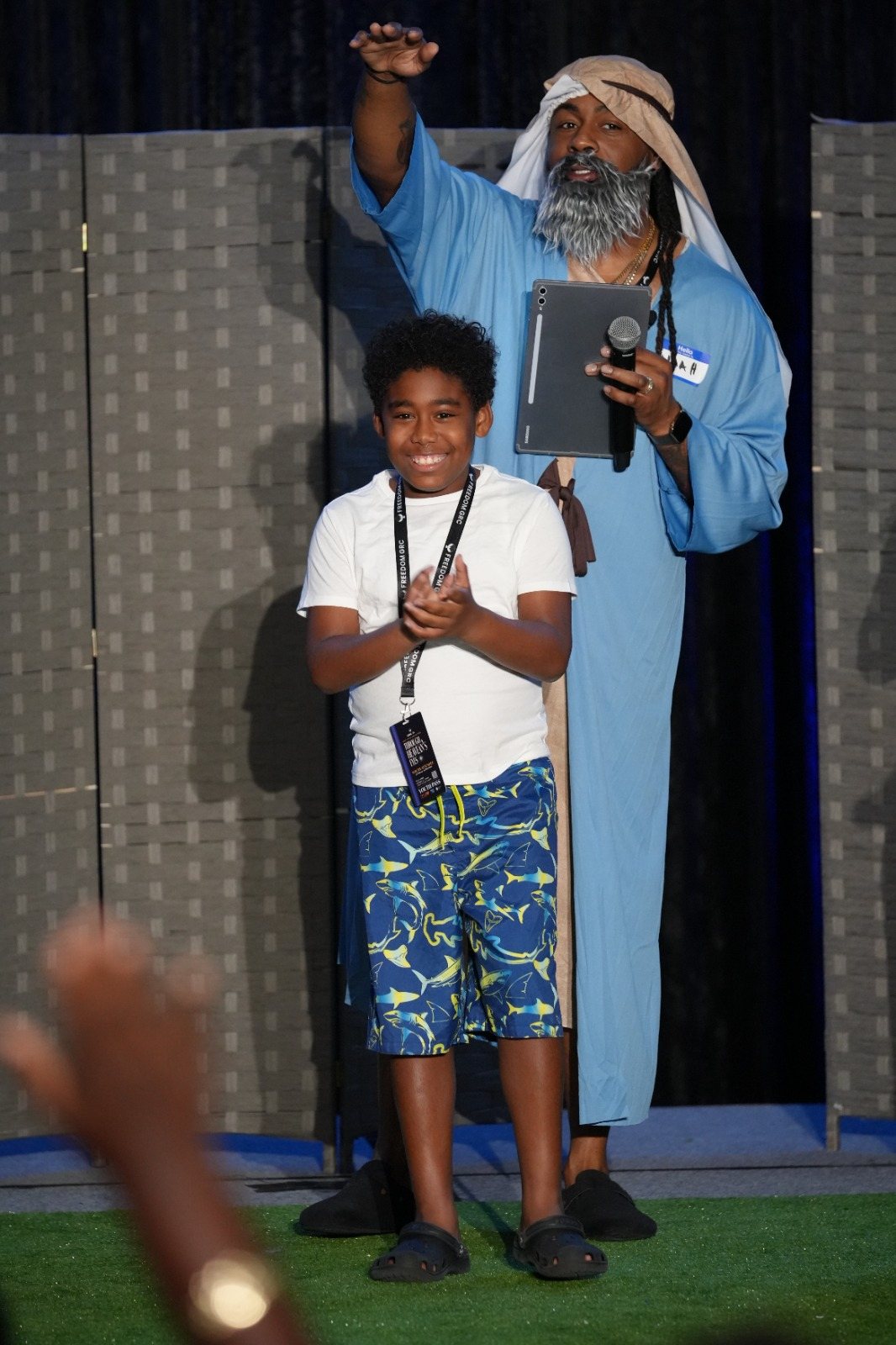 Noah listens as a guest responds during the BT Experience
