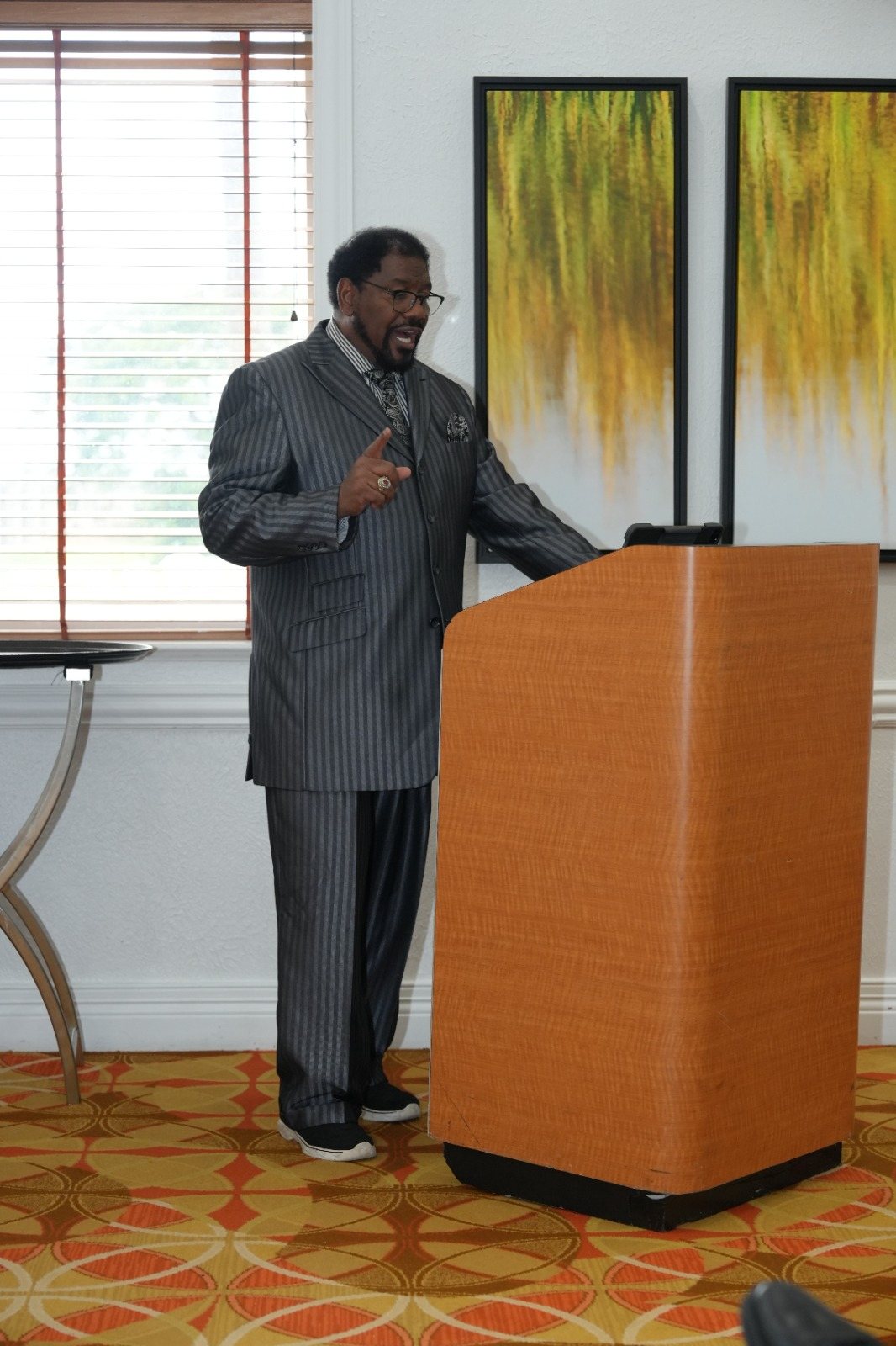 A speaker teaches from the main ballroom stage