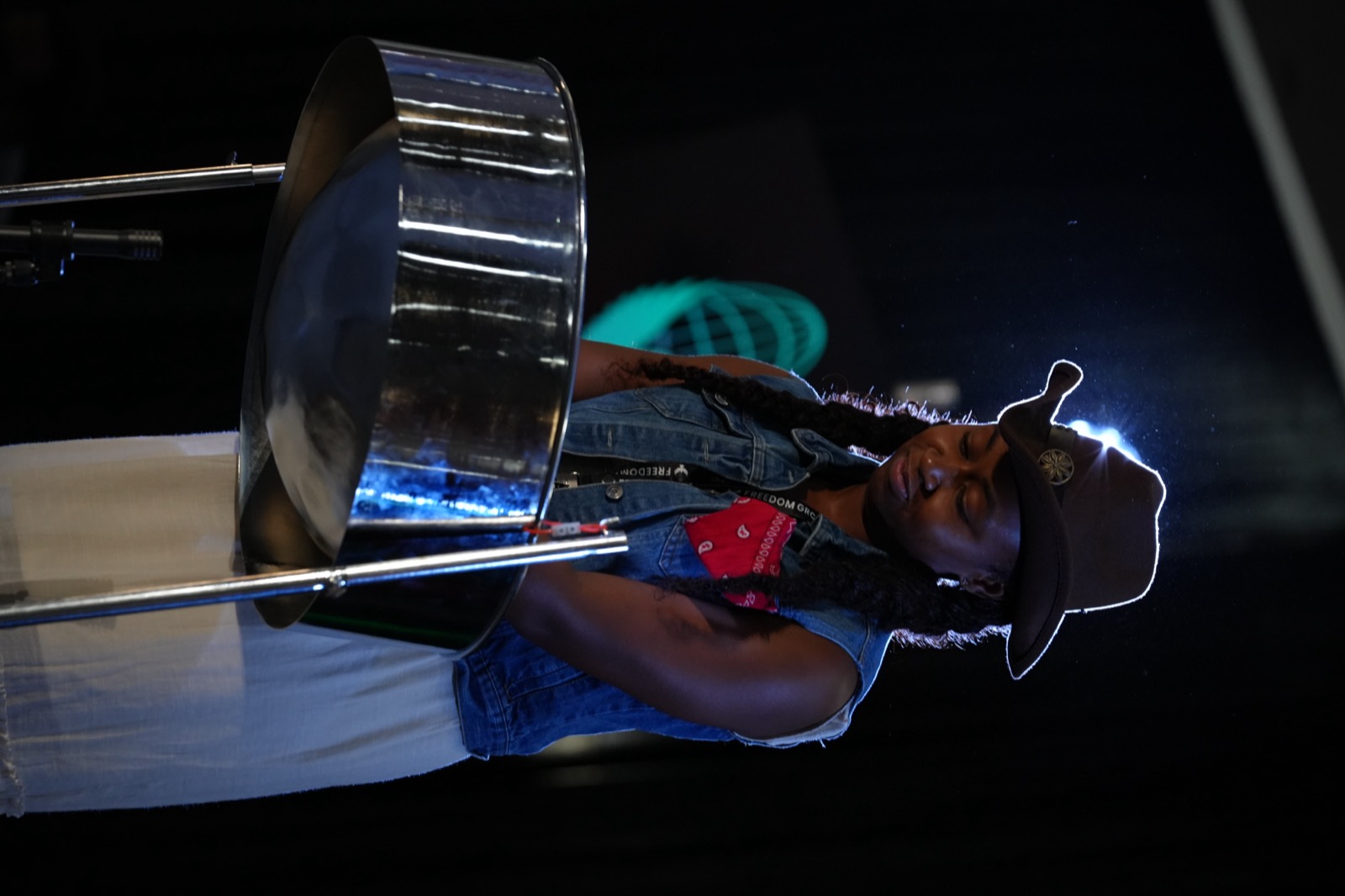 A young musician performs on steel pan during convention worship