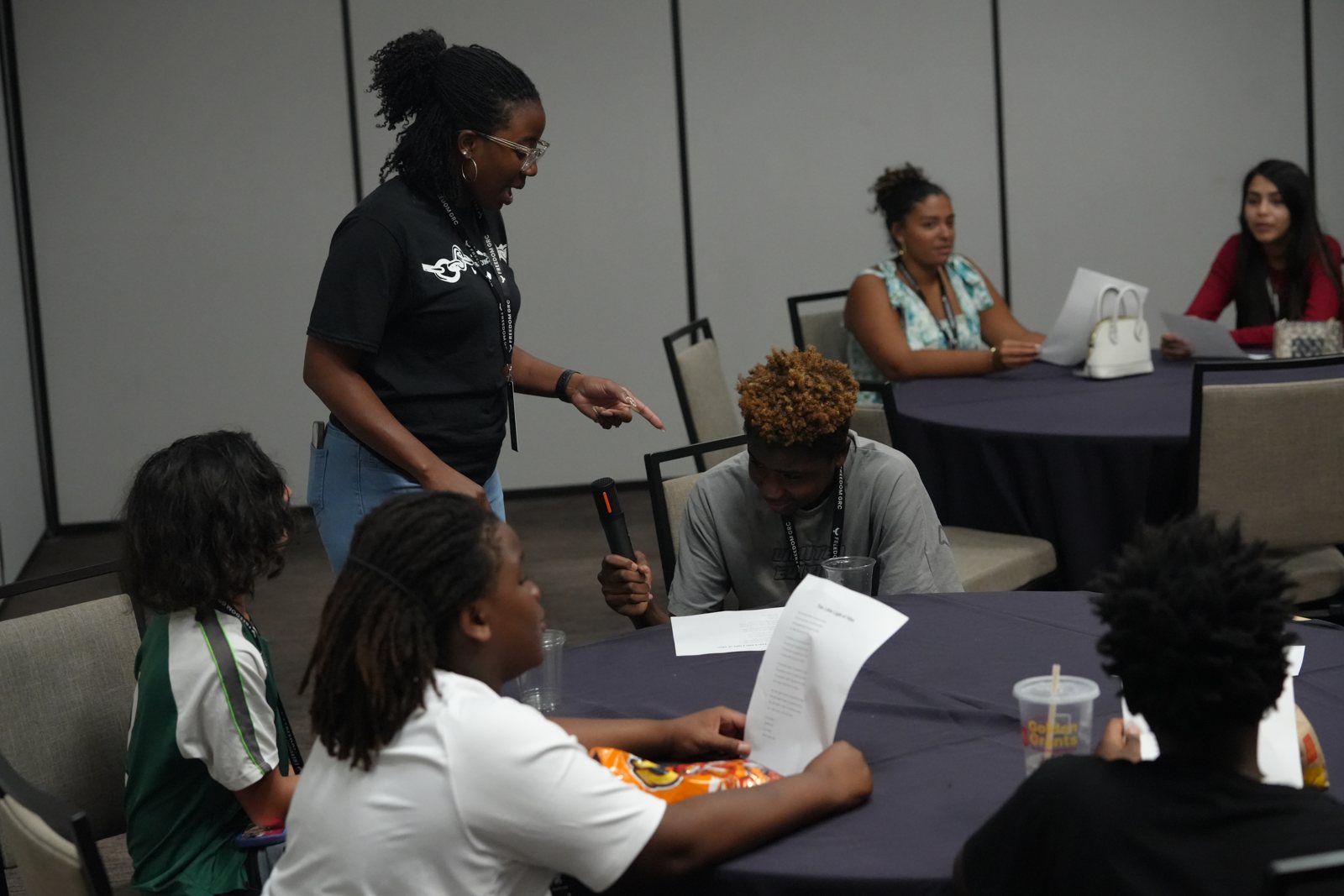 A facilitator leads young people through a NextGen group activity