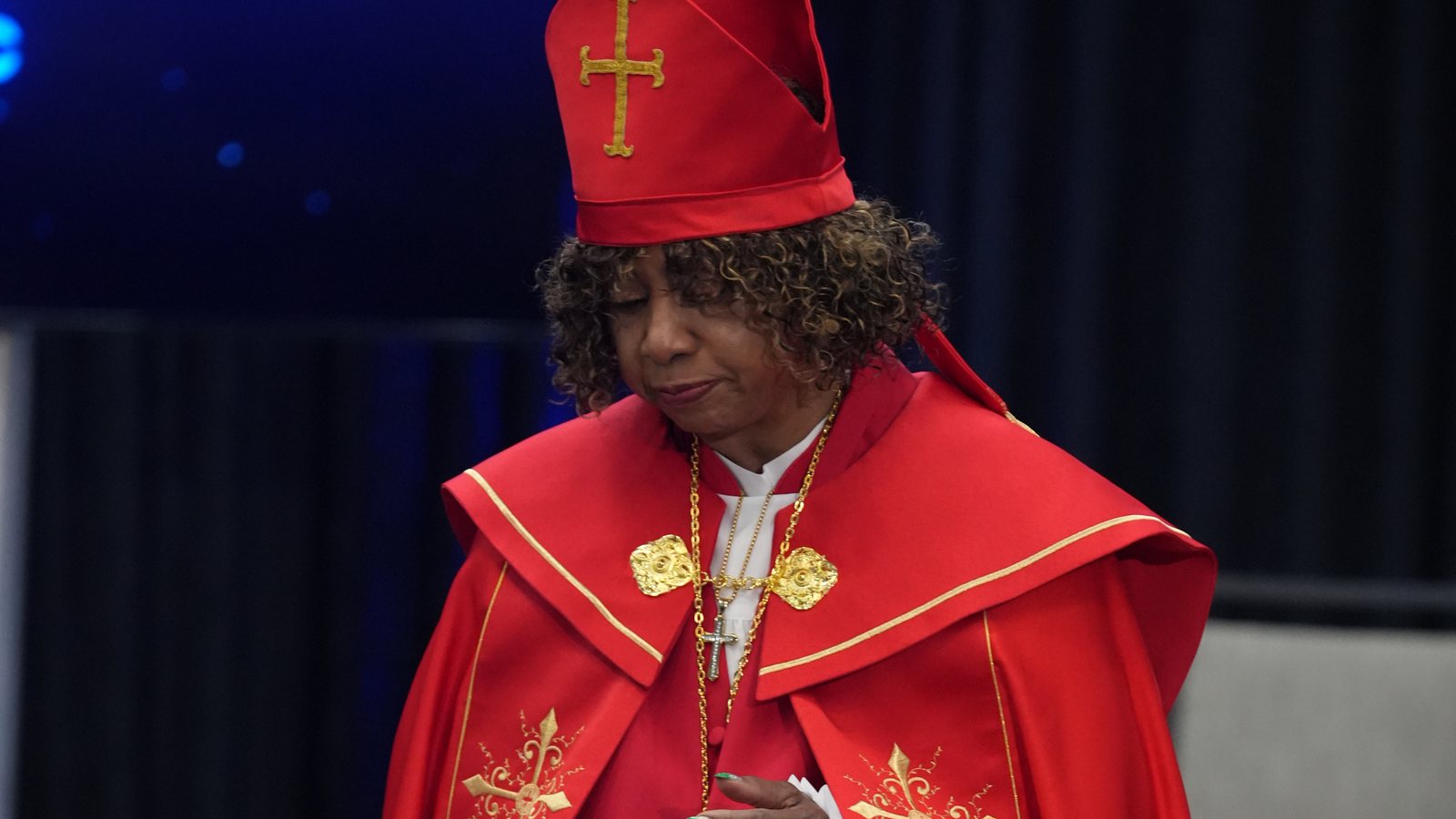 Chief Apostle Dr. Sandra Mitchell in red vestments during the FreedomGRC 2026 consecration and ordination service